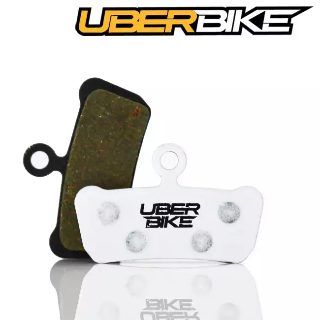 White Uberbike Race matrix disc brake pad for SRAM Guide R with Uberbike logo across the middle of it.