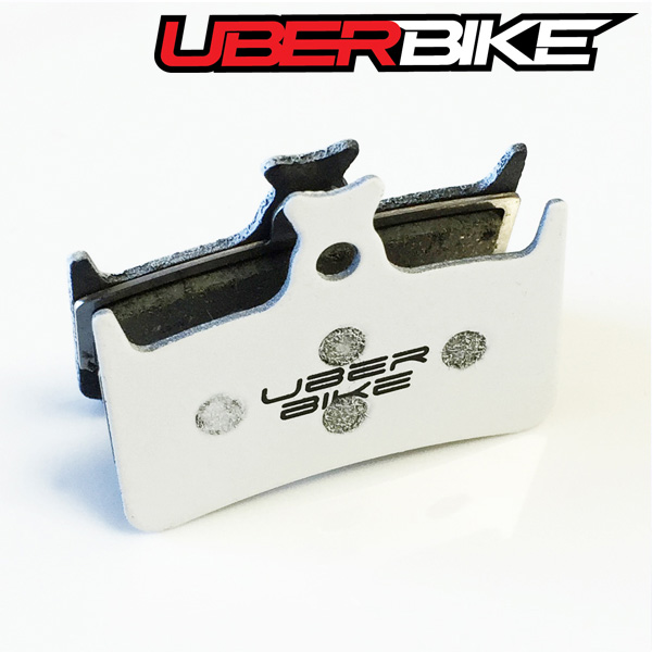 White Uberbike Finned Race Matrix Insert with Uberbike logo in the middle of it.