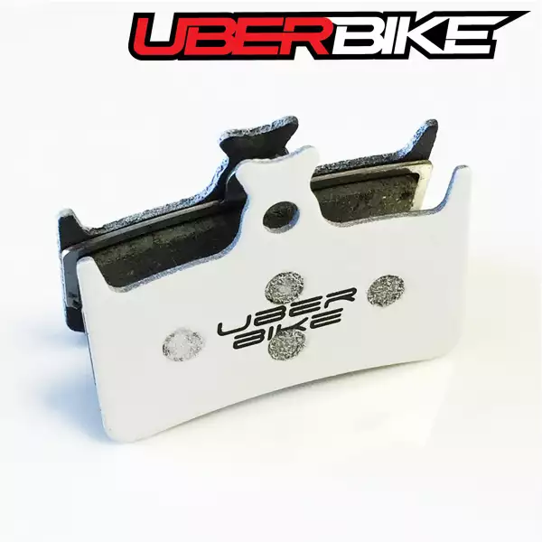 White Uberbike Finned Race Matrix Insert with Uberbike logo in the middle of it.
