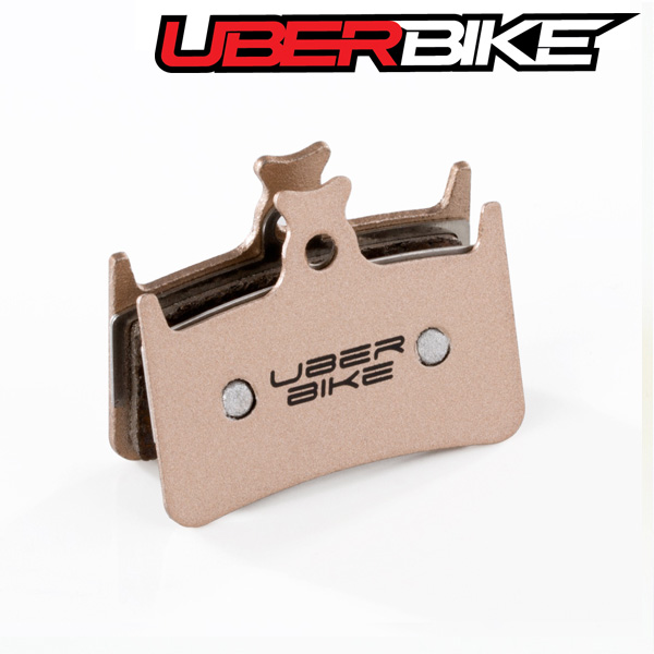 Uberbike Sintered Finned Disc Brake pad insert with Uberbike logo in middle of it.