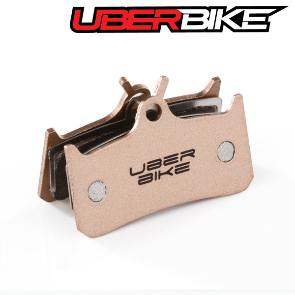 Uberbike Sintered Finned disc brake pad with Uberbike logo in the middle of it.