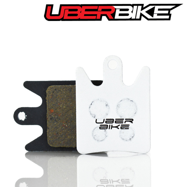 White Race Matrix Uberbike disc brake pads for Hope X2  the Uberbike logo is in the middle