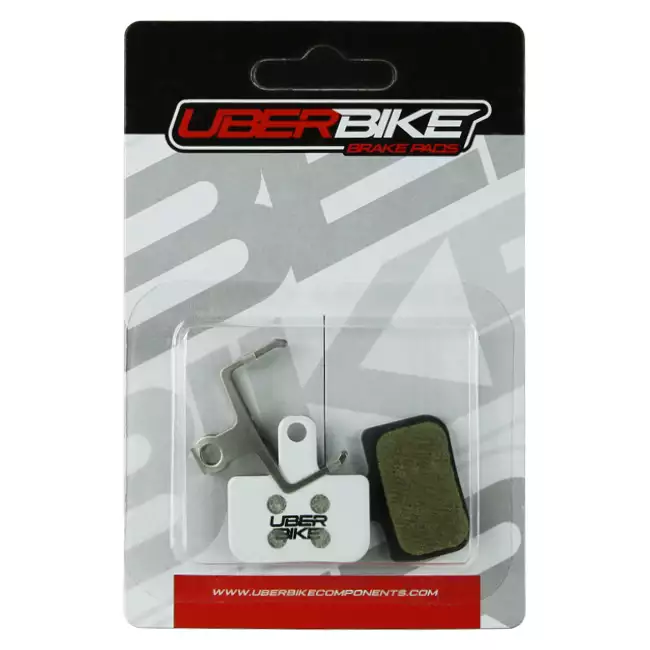 White Uberbike Race Matrix Level Disc Brake pads in packaging, with Uberbike logo in the middle.