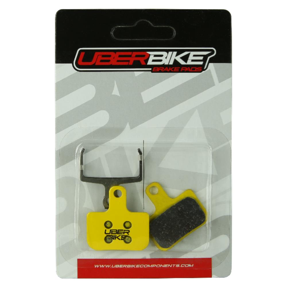 Uberbike Level Sintered Disc Brake Pads in packaging, with Uberbike Logo in the middle of them.