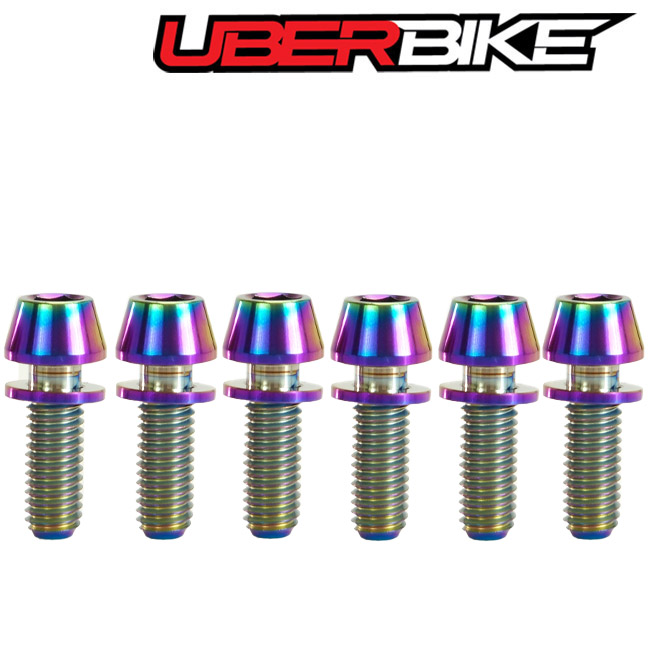 6 pieces of Uberbike M5x15 size Titanium Stem bolts in oil slick in a row.
