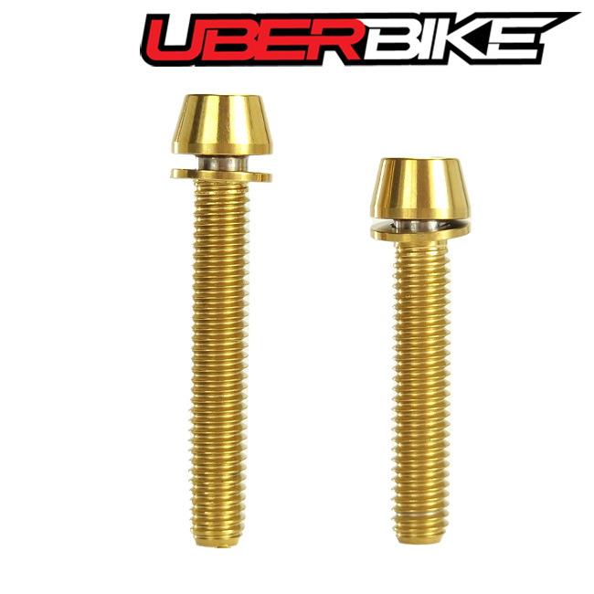Two Uberbike Titanium Mount Bolts in gold colour.