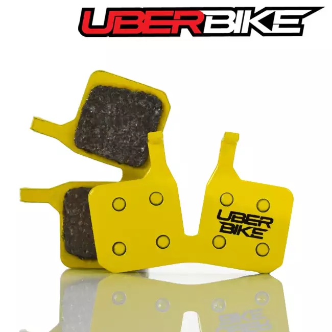 Yellow Uberbike Magurs MT5 Sintered Disc Brake pad with Uberbike logo on the right.
