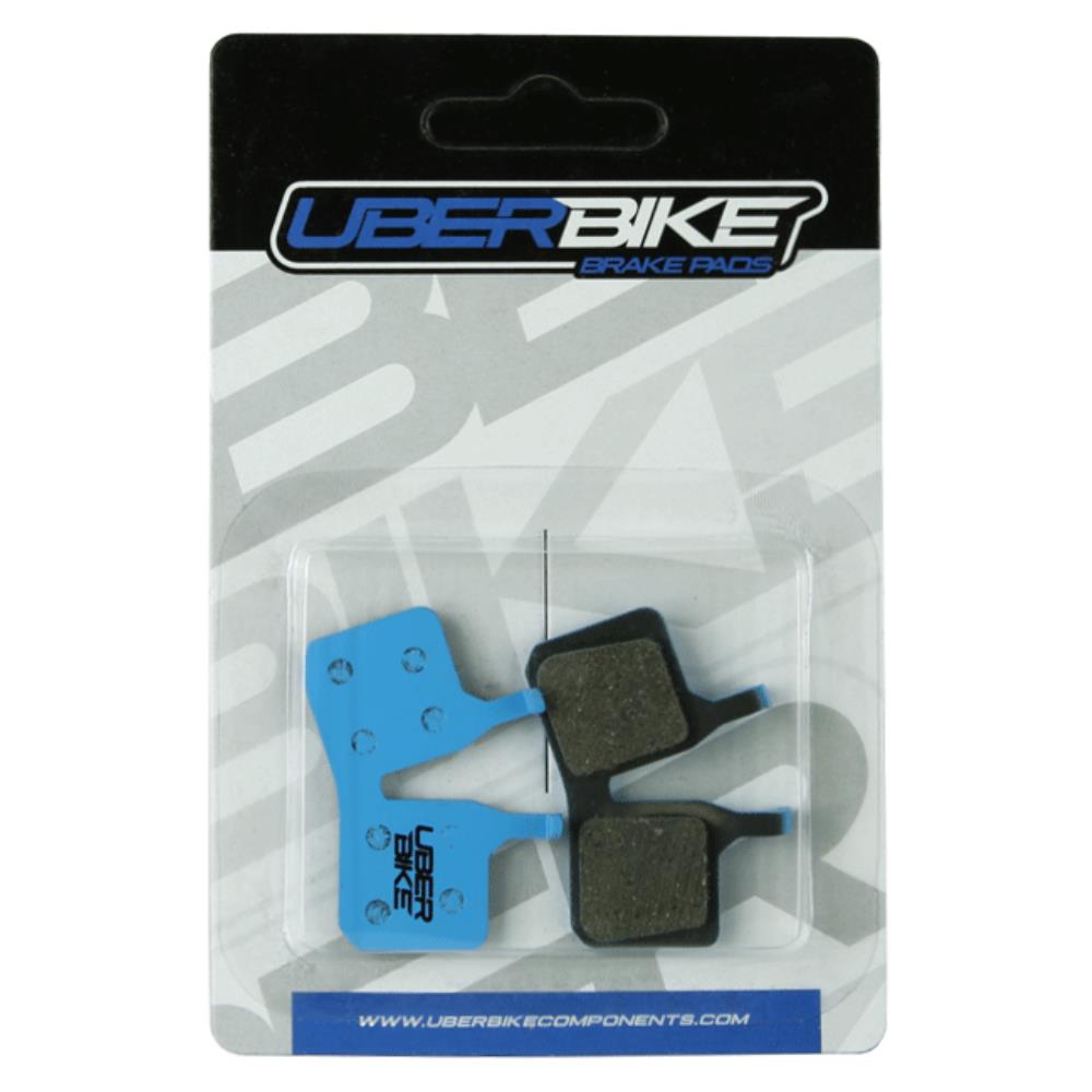 Blue Uberbike Magura MT5 E-Matrix Disc brake pads with Uberbike logo on it.