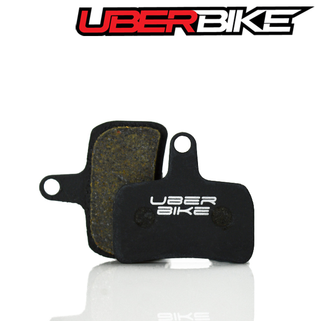 Black Semi Metallic disc brake pads, with Uberbike logo across them.