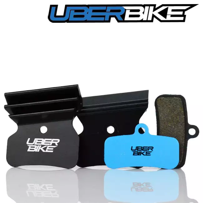 Blue E-Matrix Finned disc brake pads for Shimano M8120 with separate black finned plates, the Uberbike logo is in the middle