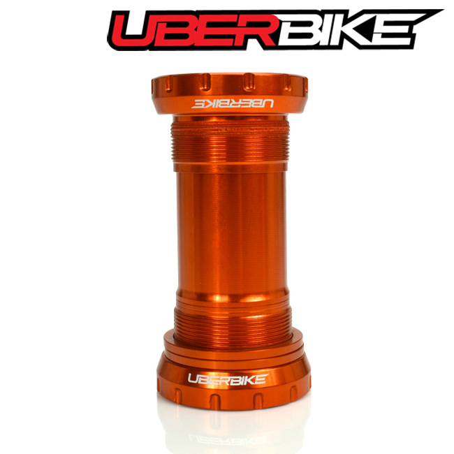 Orange SRAM DUB Bottom Bracket with the logo of Uberbike in white.