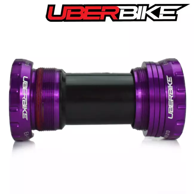 Purple bottom bracket showing a side view of it when it is laid down, the logo on it says Uberbike.