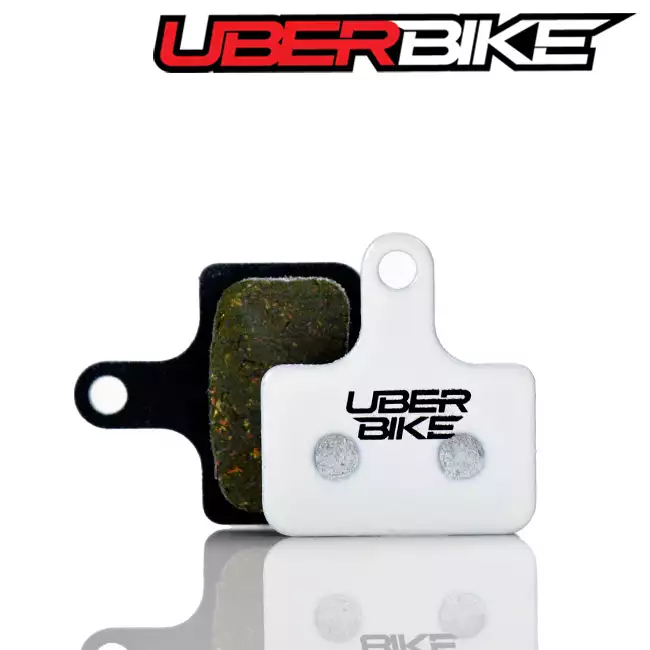 White Uberbike Race Matrix disc brake pads for Shimano RS505 the Uberbike logo is in the middle.