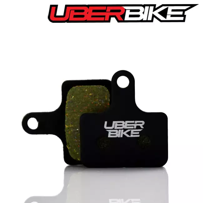 Black Semi Metallic disc brake pads for Shimano RS505 the Uberbike logo is in the middle.