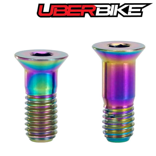 Uberbike Jockey Wheel Pulley bolts in oil slick.