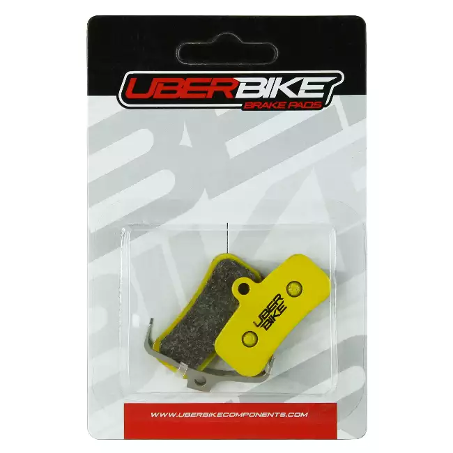 Uberbike Saint Sintered Disc brake pads in yellow colour in packaging.