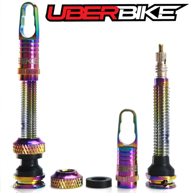 Uberbike Oil Slick Tubeless Valve - each part displayed separately.