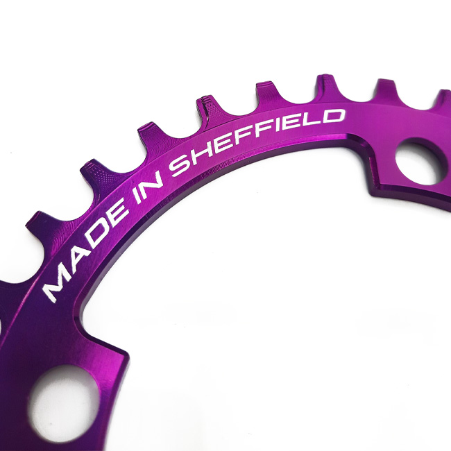 Close up of Uberbike Made in Sheffield Purple chainring.