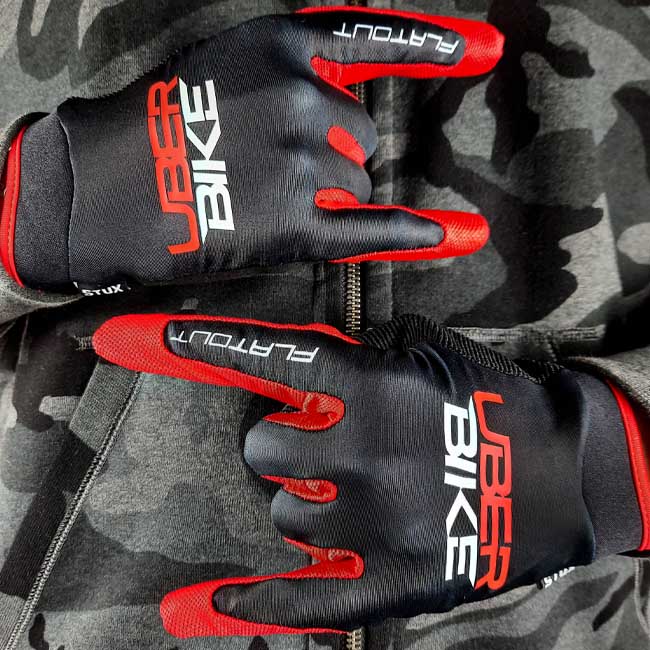 Uberbike Flatout Gloves - in black/ red colour with Uberbike logo on them.